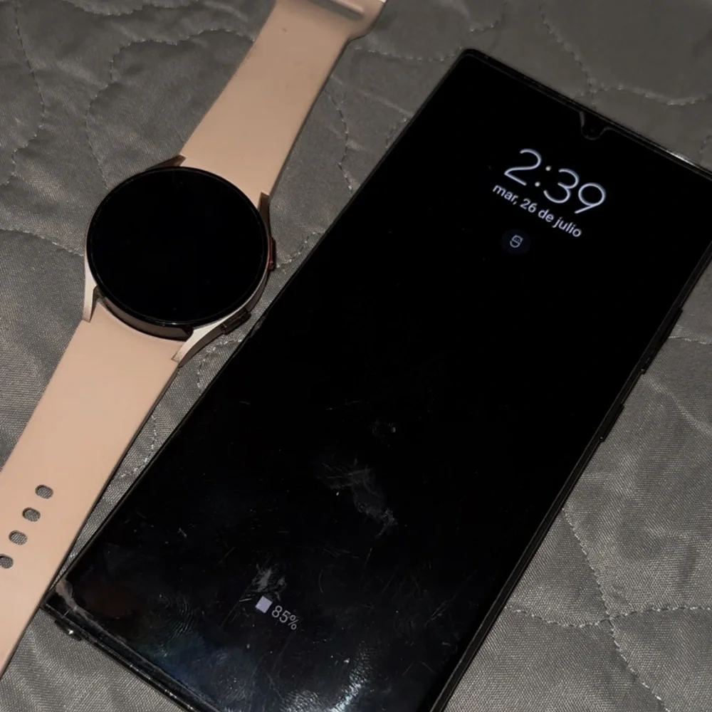 Samsung Black Smartphone with Pink Smartwatch
